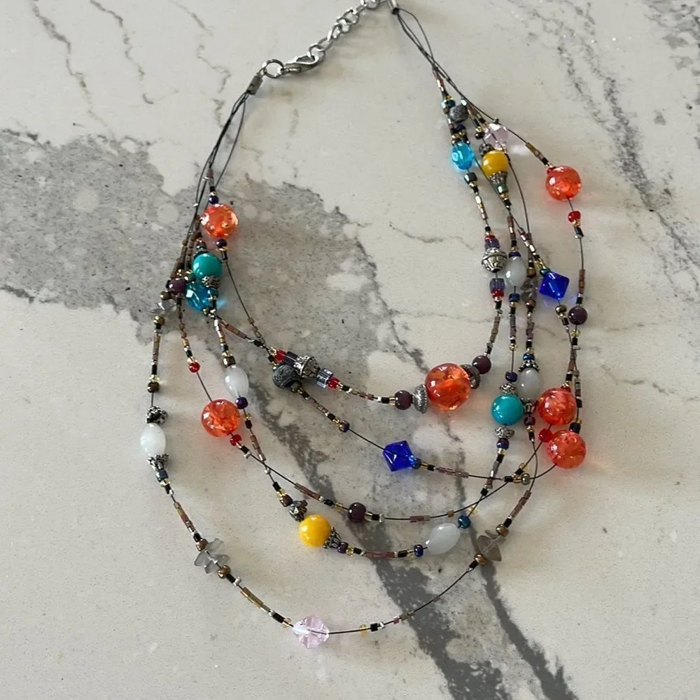 Fun multi color glass head necklace. All of the beads are glass. Art event